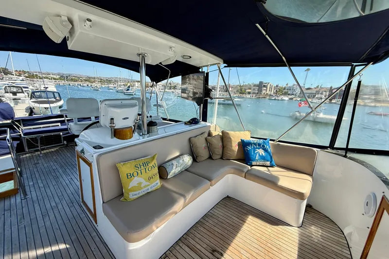 Slide: The Image of Luxurious 1991 Kong & Halvorsen Island Gypsy yacht interior with comfortable seating and scenic marina view. - 41