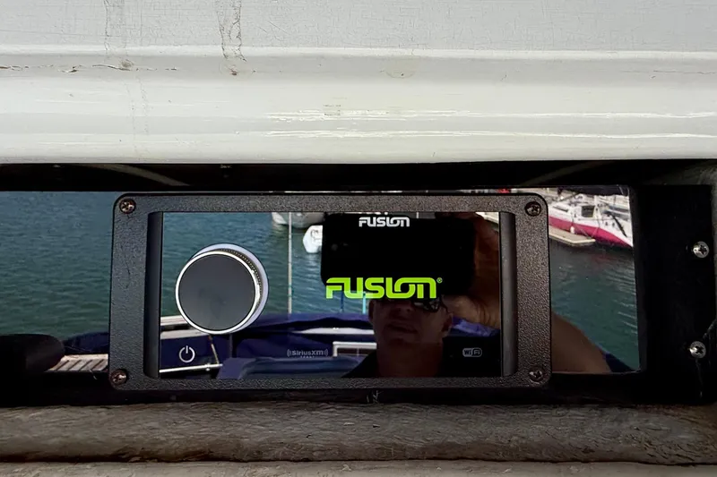 Slide: The Image of Fusion audio system on a 1991 Kong & Halvorsen Island Gypsy yacht, with marina reflection. - 43