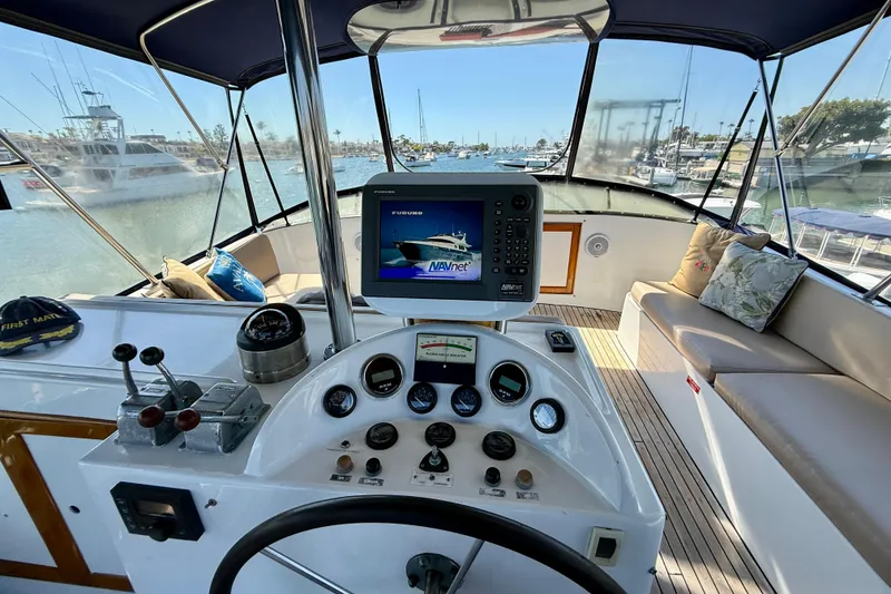 Slide: The Image of 1991 Kong & Halvorsen Island Gypsy yacht helm with navigation equipment and seating area. - 44