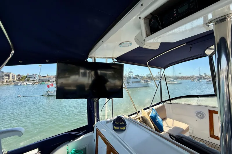 Slide: The Image of Interior view of 1991 Kong & Halvorsen Island Gypsy yacht with marina backdrop. - 47