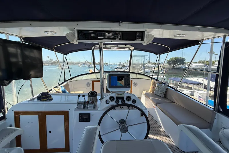 Slide: The Image of 1991 Kong & Halvorsen Island Gypsy yacht helm with navigation equipment and marina view. - 51