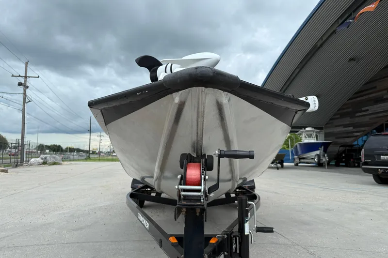 Slide: The Image of 2011 Bass Tracker PRO TEAM 190 TX boat on trailer, under cloudy sky. - 3