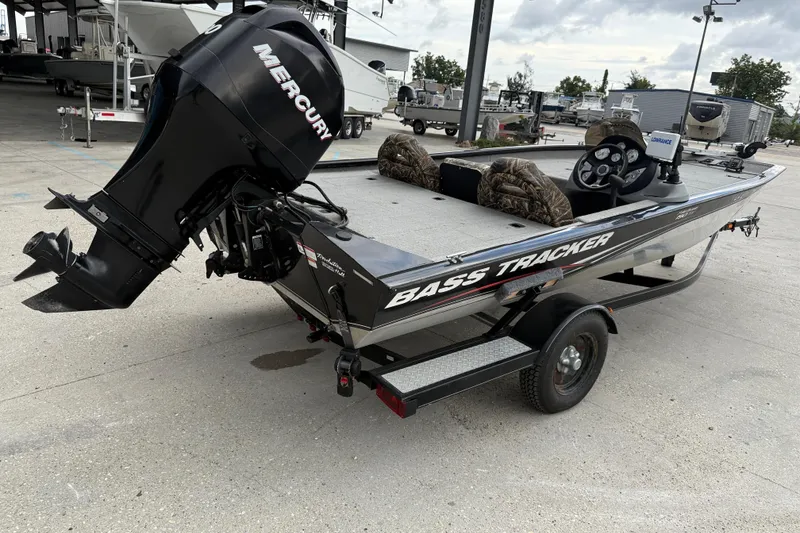 Slide: The Image of 2011 Bass Tracker PRO TEAM 190 TX boat with Mercury engine on trailer. - 7