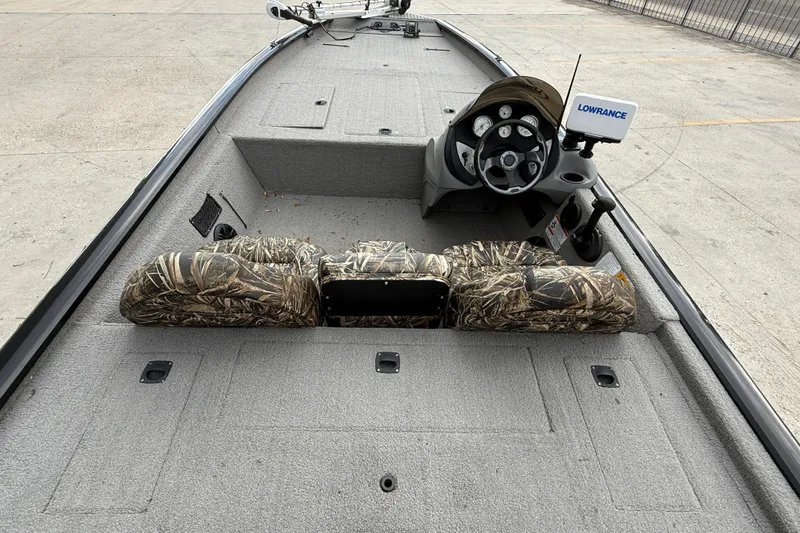 Slide: The Image of 2011 Bass Tracker PRO TEAM 190 TX boat interior with camo seats and Lowrance system. - 8