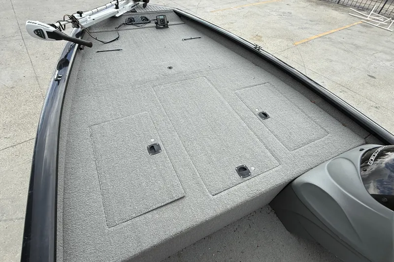 Slide: The Image of 2011 Bass Tracker PRO TEAM 190 TX boat deck with storage compartments and trolling motor. - 9