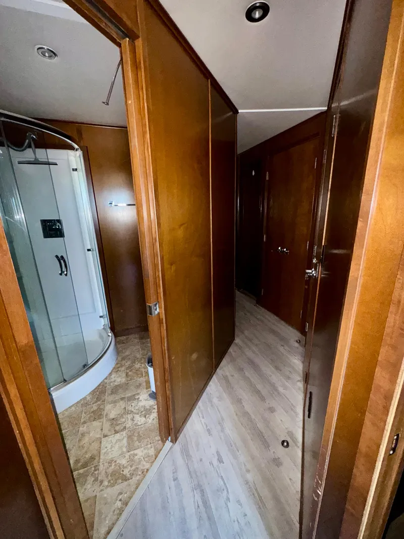 Slide: The Image of Interior hallway of 2013 Bravada Bella Luna Share #8 with wooden doors and modern shower. - 14