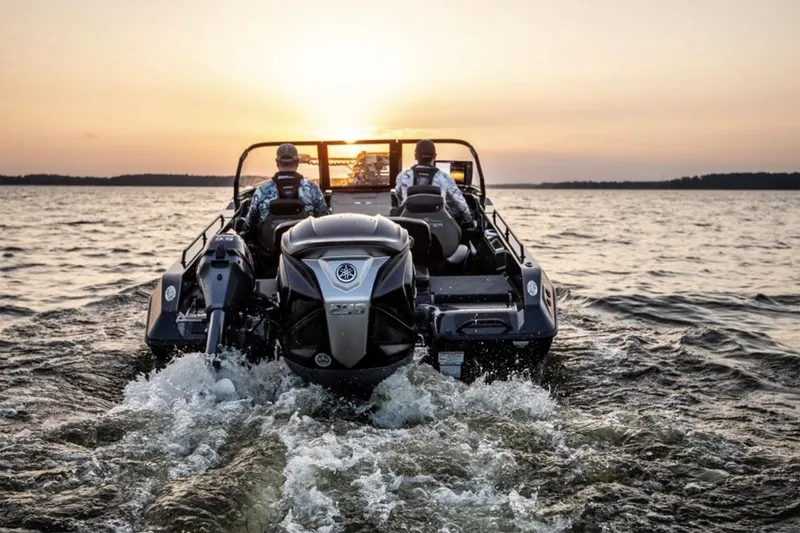 Slide: The Image of Manufacturer Provided Image: 2026 Skeeter WXR2060 F boat cruising on a lake at sunset. - 5