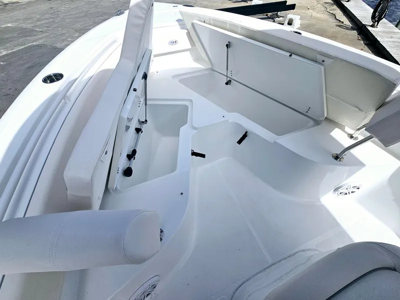 Slide: The Image of 2025 Sea Hunt Ultra 239 SE boat interior with open storage compartments. - 14