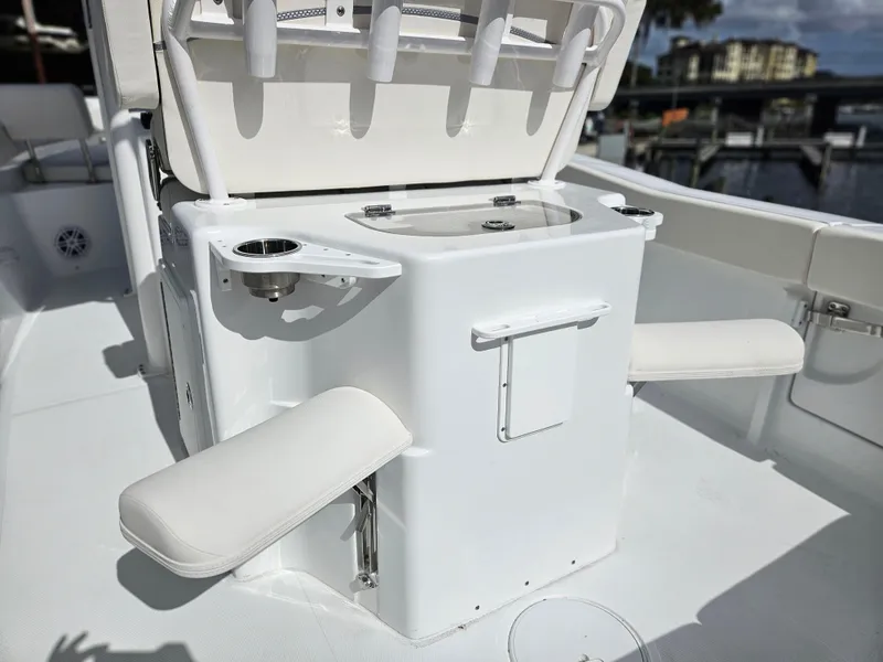 Slide: The Image of 2025 Sea Hunt Ultra 239 SE boat interior with seating and storage features. - 23
