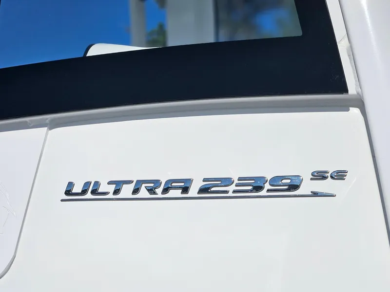 Slide: The Image of 2025 Sea Hunt Ultra 239 SE boat emblem on white surface. - 28