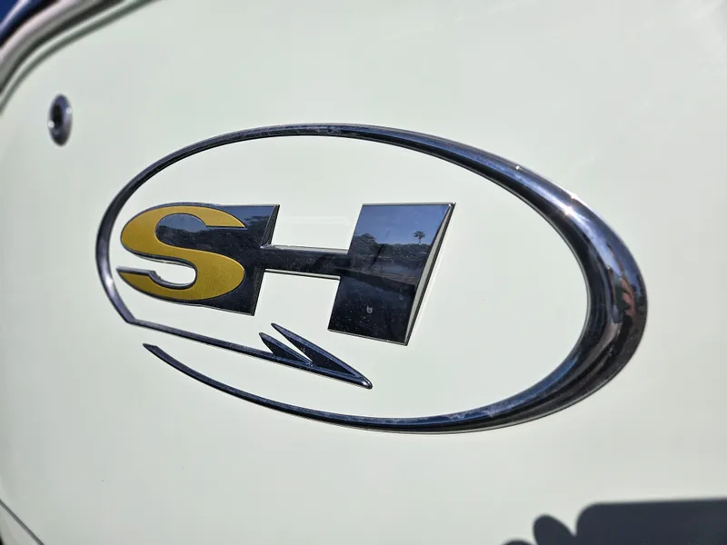 Slide: The Image of Sea Hunt Ultra 239 SE 2025 logo emblem on boat exterior. - 29