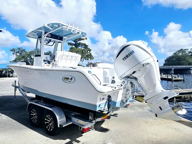 Slide: The Image of 2025 Sea Hunt Ultra 239 SE boat on trailer with Yamaha outboard motor. - 5