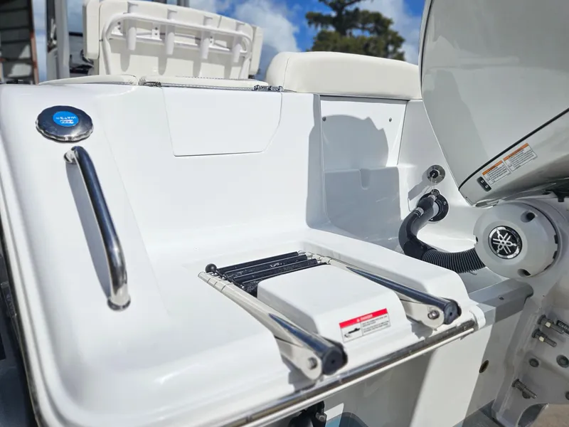 Slide: The Image of 2025 Sea Hunt Ultra 239 SE boat with swim platform and ladder. - 6