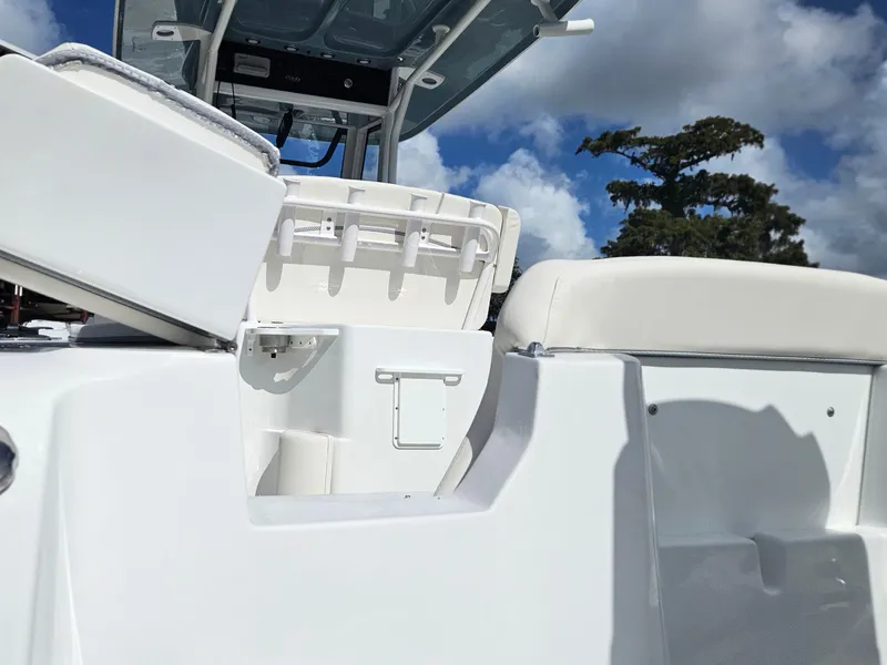 Slide: The Image of 2025 Sea Hunt Ultra 239 SE boat interior with seating and storage compartments. - 7