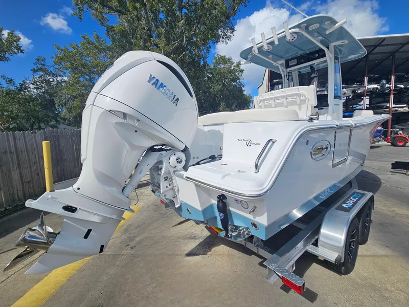 Slide: The Image of 2025 Sea Hunt Ultra 239 SE boat with Yamaha outboard motor on trailer. - 9