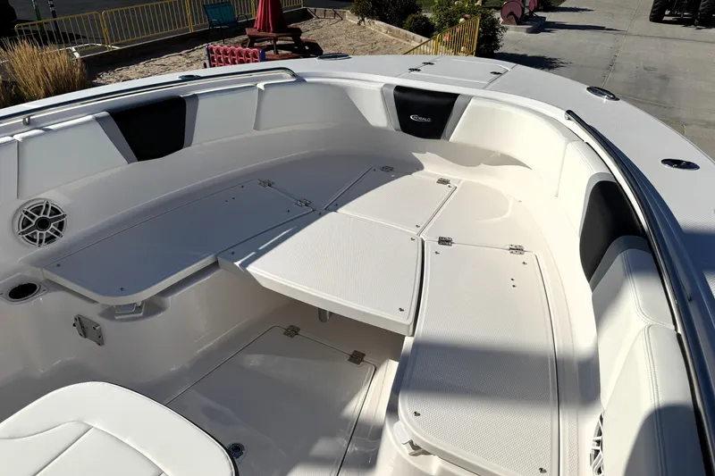 Slide: The Image of 2025 Robalo R270 Center Console boat interior with seating and storage compartments. - 14