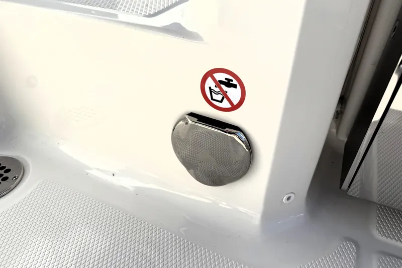 Slide: The Image of 2025 Robalo R270 Center Console boat detail with no-drinking-water sign. - 28