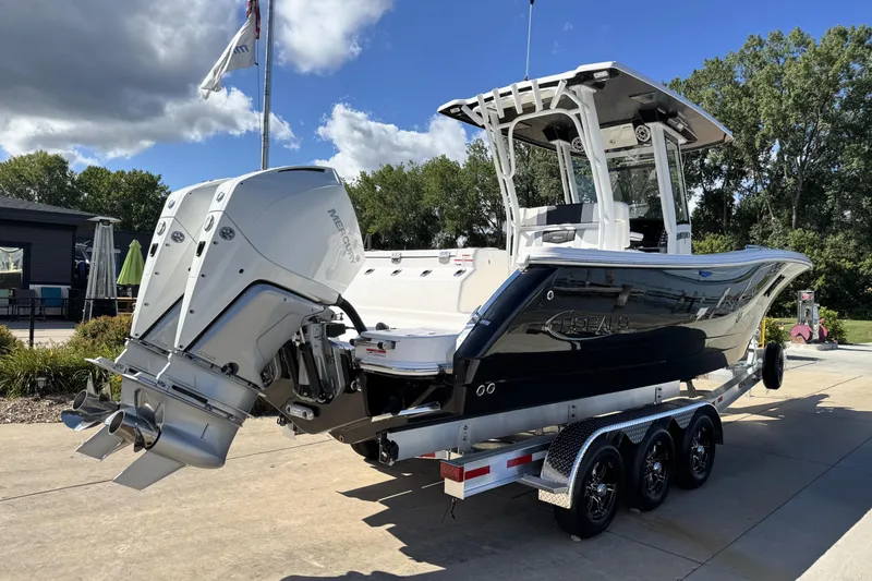 Slide: The Image of 2025 Robalo R270 Center Console boat on trailer, featuring dual Mercury outboard engines. - 3