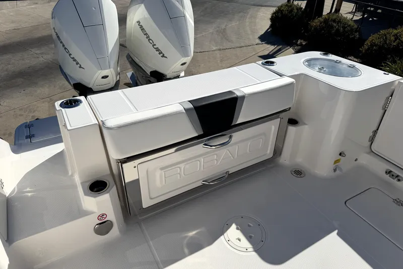 Slide: The Image of 2025 Robalo R270 Center Console boat with dual Mercury engines, featuring sleek seating and storage. - 34