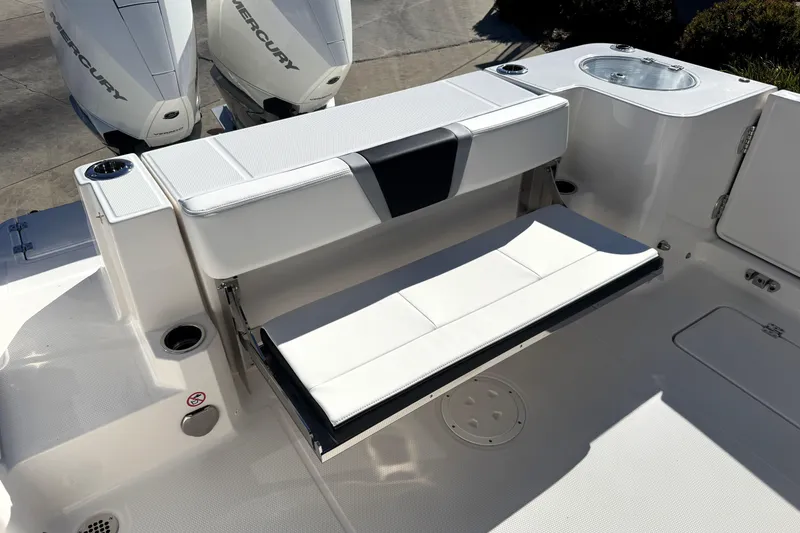 Slide: The Image of 2025 Robalo R270 Center Console boat with foldable seating and dual Mercury engines. - 35