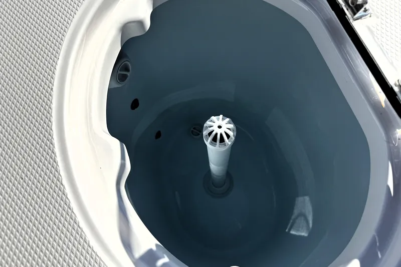 Slide: The Image of Livewell of 2025 Robalo R270 Center Console boat, featuring a clean, white interior design. - 36