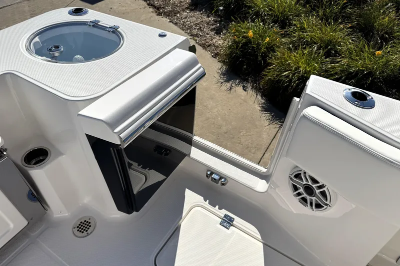 Slide: The Image of 2025 Robalo R270 Center Console boat interior with livewell and speaker detail. - 38