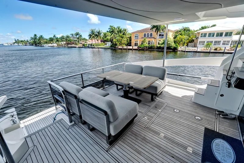 Slide: The Image of Luxury deck of 2025 Absolute 52 FLY yacht with waterfront view. - 14