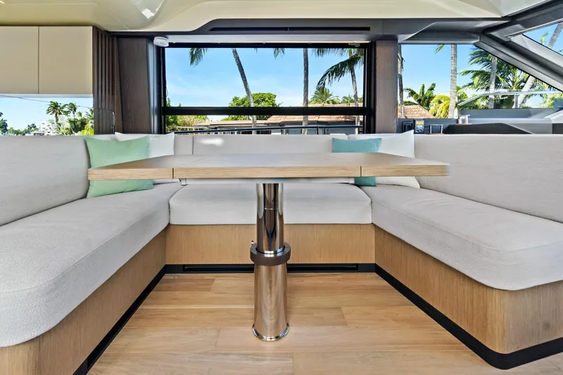 Slide: The Image of Luxurious interior of 2025 Absolute 52 FLY yacht with elegant seating and table. - 40
