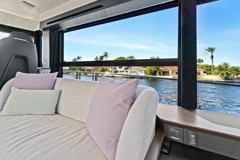 Slide: The Image of Luxurious interior of 2025 Absolute 52 FLY yacht with waterfront view. - 42