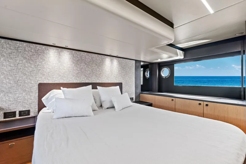 Slide: The Image of Luxurious bedroom on 2025 Absolute 52 FLY yacht with ocean view. - 53
