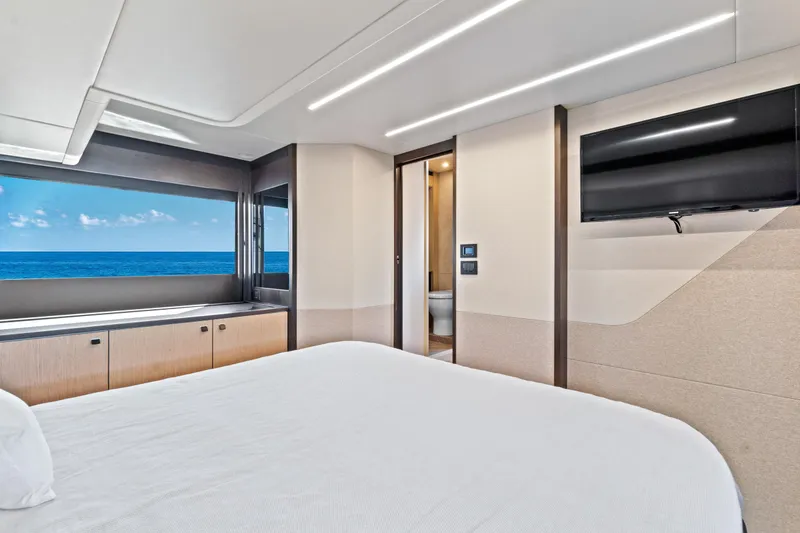 Slide: The Image of Luxurious bedroom interior of 2025 Absolute 52 FLY yacht with ocean view. - 54