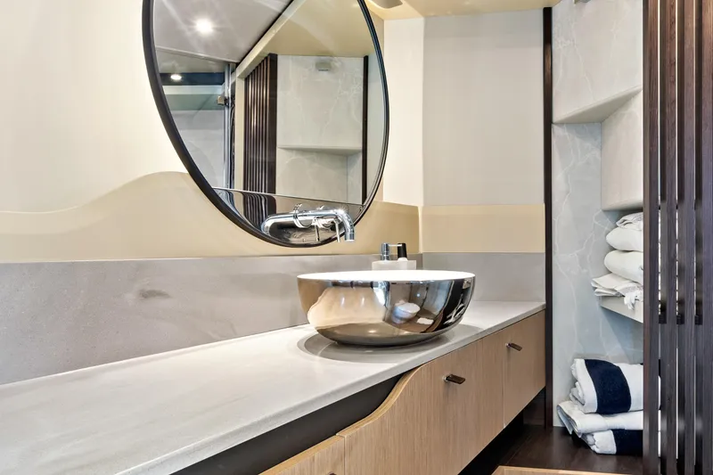 Slide: The Image of Luxurious bathroom in 2025 Absolute 52 FLY yacht with modern sink and mirror. - 64