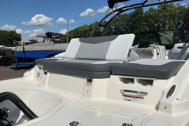 Slide: The Image of 2026 Chaparral 23 SSi OB boat interior with cushioned seating and sleek design. - 12