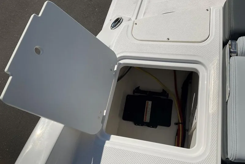 Slide: The Image of Open storage compartment on 2026 Chaparral 23 SSi OB boat, showcasing interior space. - 19