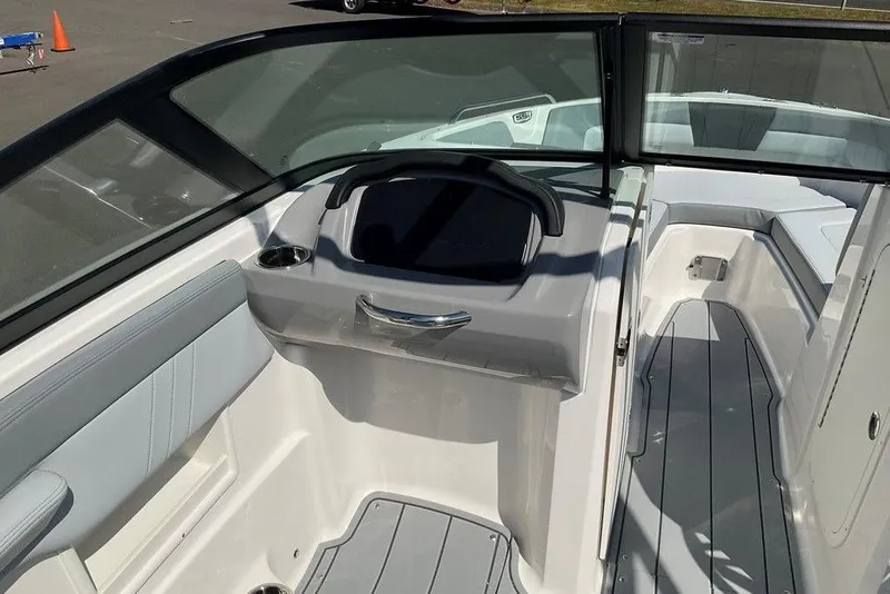 Slide: The Image of 2026 Chaparral 23 SSi OB boat interior with sleek seating and modern dashboard design. - 25