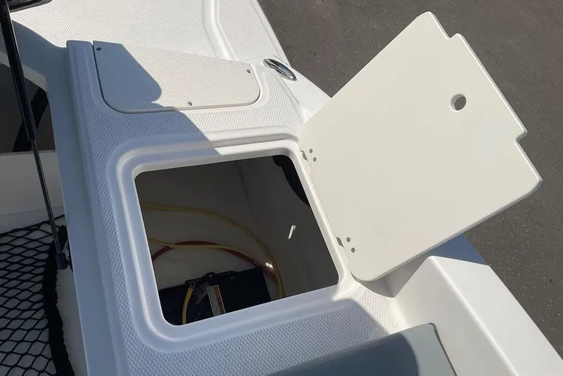 Slide: The Image of Open storage compartment on 2026 Chaparral 23 SSi OB boat. - 26