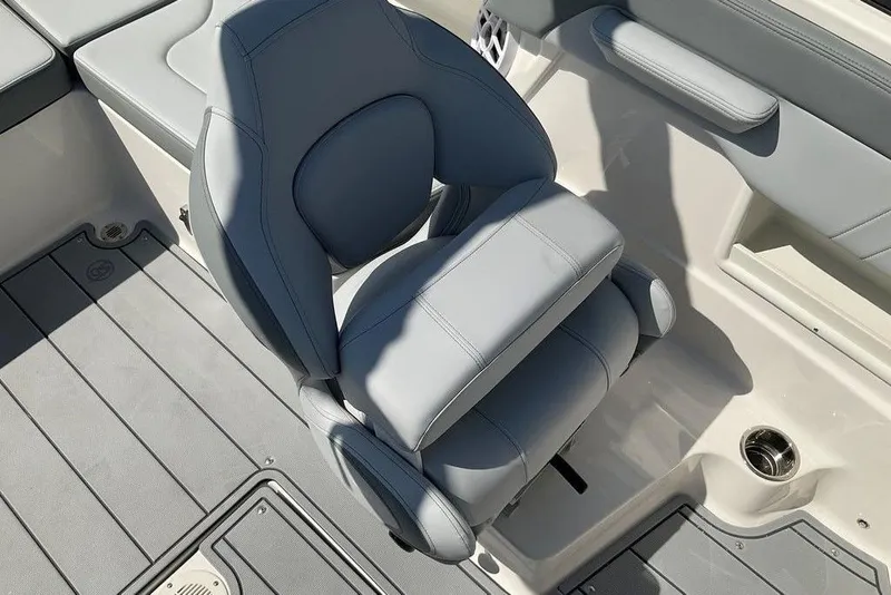 Slide: The Image of 2026 Chaparral 23 SSi OB boat interior with gray seating and flooring. - 27