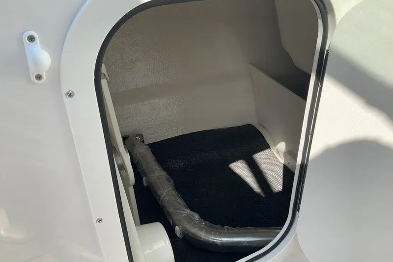 Slide: The Image of Interior storage compartment of 2026 Chaparral 23 SSi OB boat. - 36