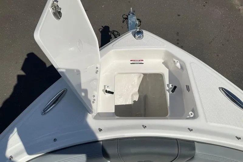 Slide: The Image of Open storage compartment on 2026 Chaparral 23 SSi OB boat, showcasing interior space. - 39