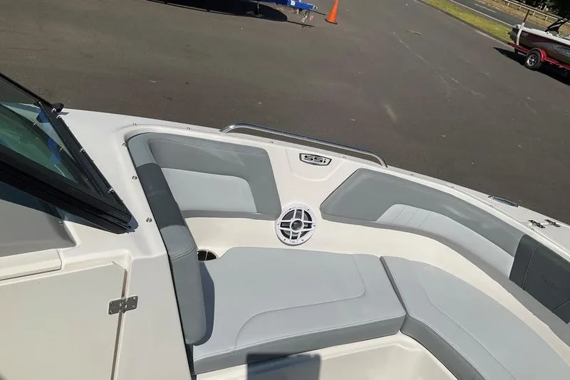 Slide: The Image of 2026 Chaparral 23 SSi OB boat interior with gray seating and speaker. - 40