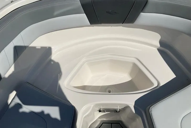 Slide: The Image of Interior view of 2026 Chaparral 23 SSi OB boat, featuring sleek seating and storage. - 43