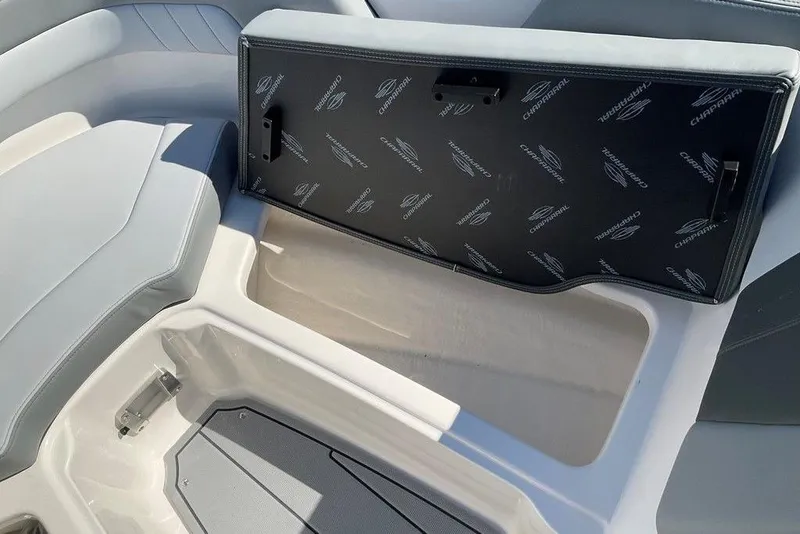 Slide: The Image of Interior view of 2026 Chaparral 23 SSi OB boat, featuring seating and storage area. - 44