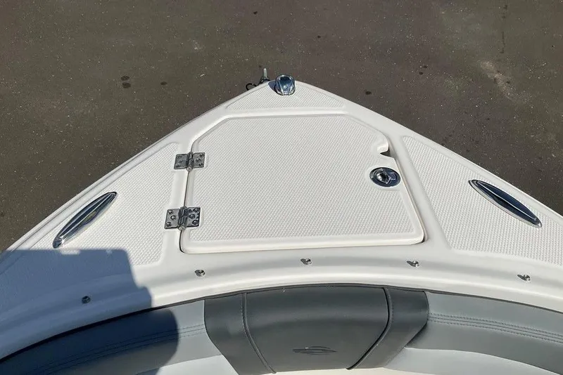 Slide: The Image of Bow of 2026 Chaparral 23 SSi OB boat with storage compartment and seating. - 46