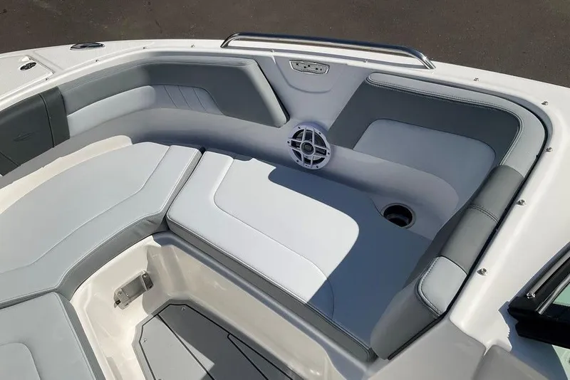 Slide: The Image of 2026 Chaparral 23 SSi OB boat interior with gray seating and speaker system. - 47