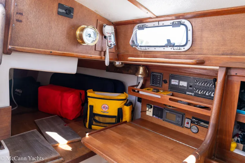 Slide: The Image of Interior of a 1985 Tartan 34-2 yacht with navigation equipment and storage. - 14