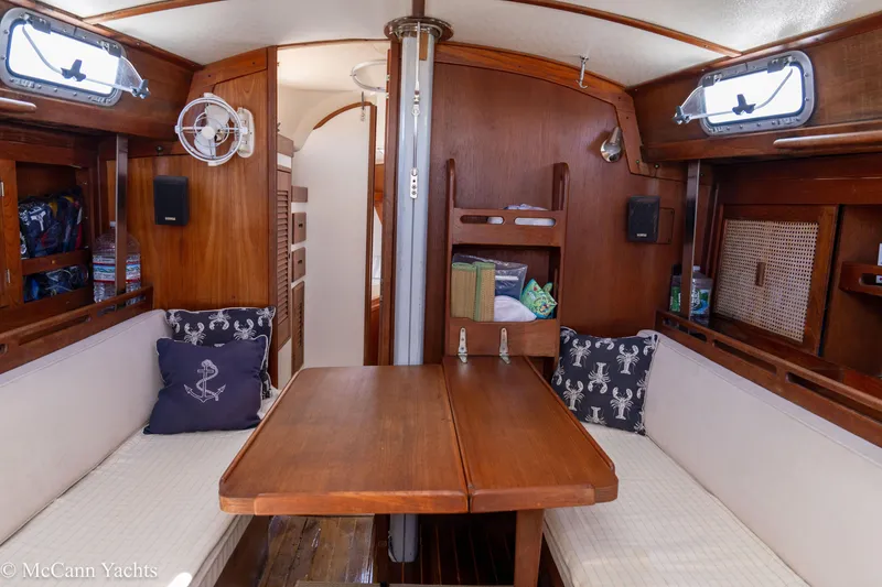 Slide: The Image of Interior of 1985 Tartan 34-2 yacht with wooden furnishings and nautical decor. - 19