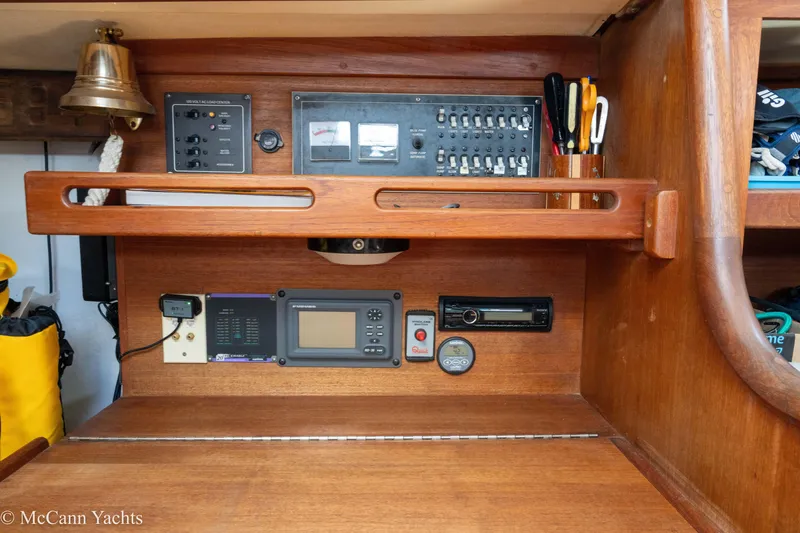 Slide: The Image of Control panel of a 1985 Tartan 34-2 yacht with navigation instruments and wooden finish. - 23