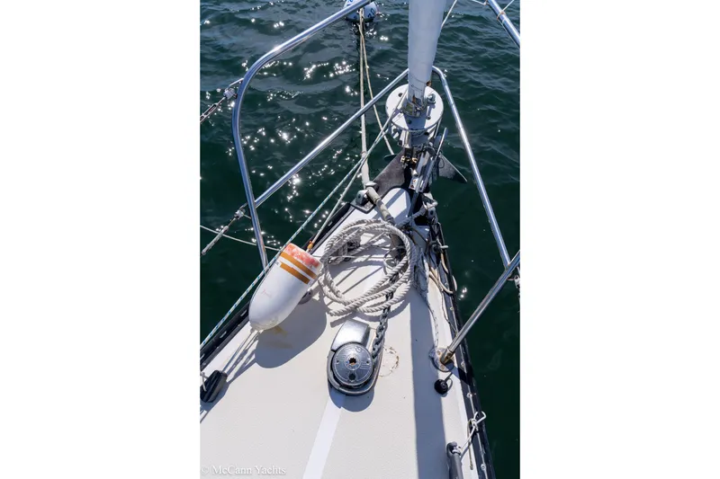 Slide: The Image of Bow of 1985 Tartan 34-2 sailboat with anchor and ropes on deck. - 40