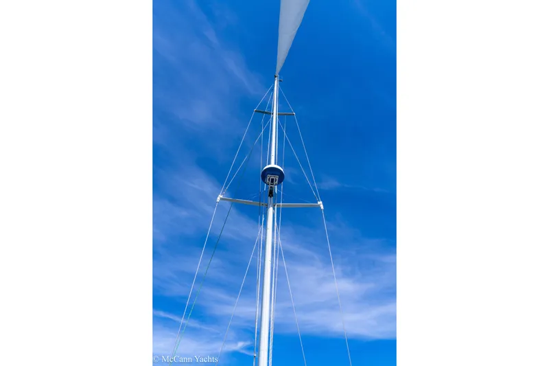 Slide: The Image of Mast of 1985 Tartan 34-2 sailboat against a clear blue sky. - 49