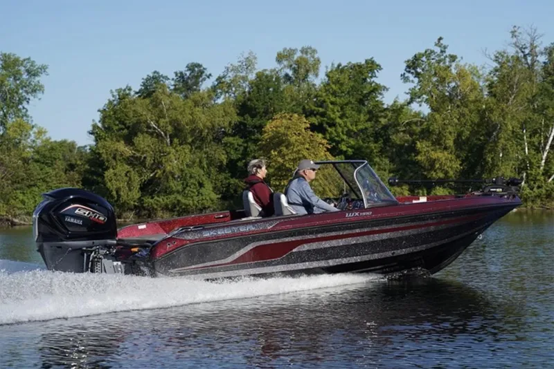 Slide: The Image of 2026 Skeeter WX1910 boat in showroom, featuring Minn Kota trolling motor. - 1